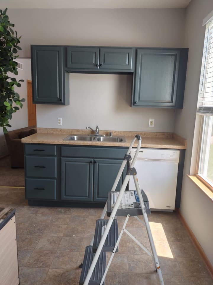 dark blue painted kitchen cabinets with Emerald Paint for a Milwaukee home